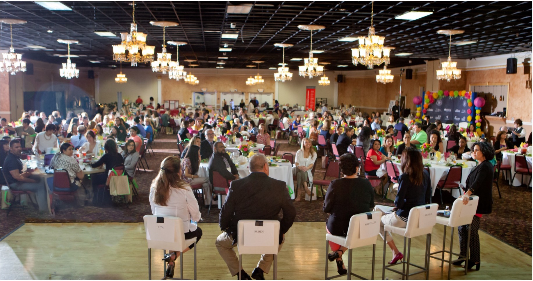 people sitting at round tables during convention